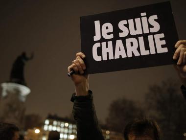 Карикатура на бог убиец отбелязва година от атентата в „Шарли Ебдо“