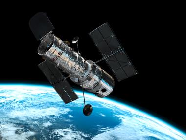 Hubble засне срещата на три луни пред диска на Юпитер